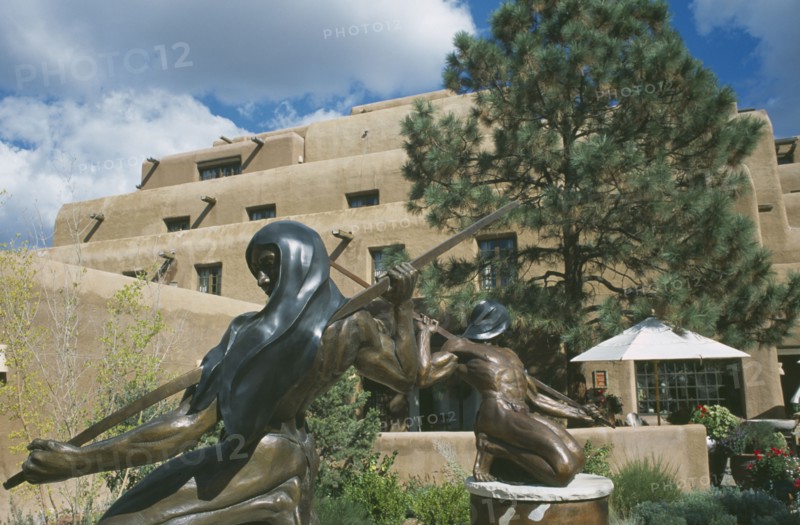 USA, New Mexico, Santa Fe, Sculptures outside hotel entrance