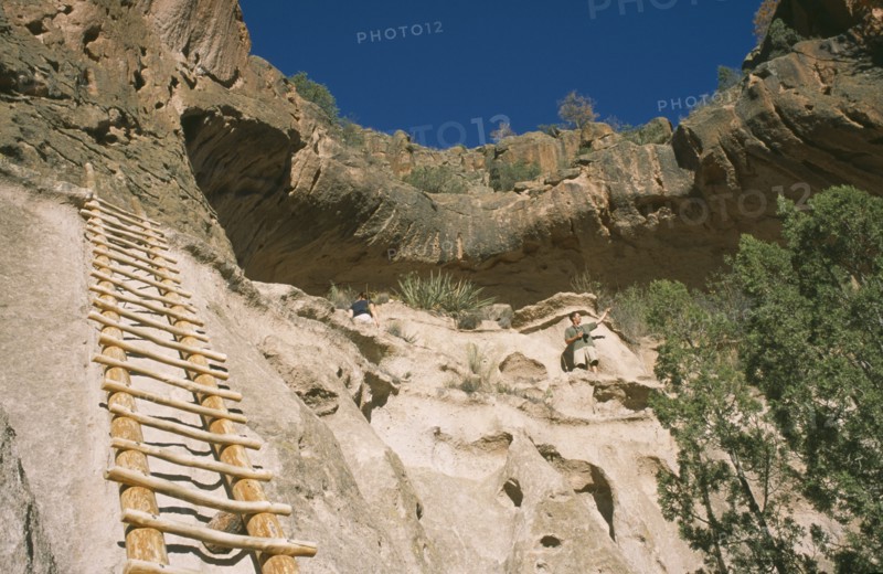 USA, New Mexico, Bandalier, Wooden ladder into Anasazi Indian cave dwelling in the national monument