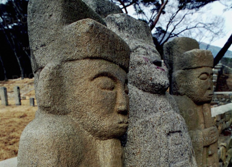 SOUTH KOREA, Tongdosa, Carved Guardian Stones standing in a row at the Buddhist Temple