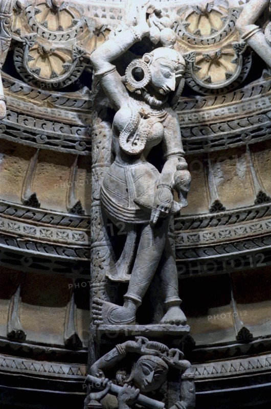 INDIA, Rajasthan, Mt Abu, Decorative carved marble figure at one of the Dilwara Temples