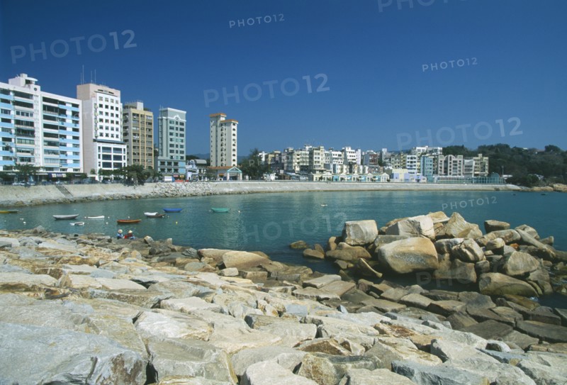 HONG KONG, Stanley, View over the beach with high res apartment buildings along shore