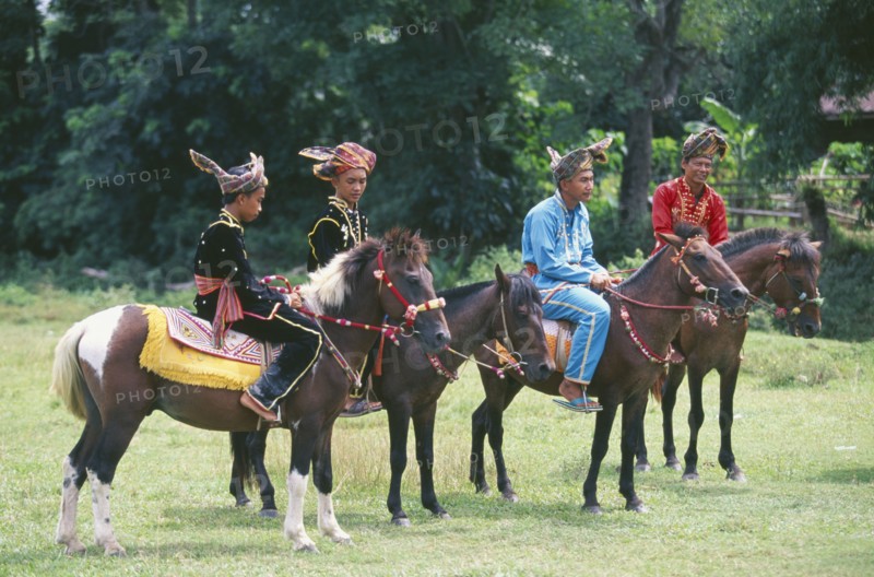 BORNEO, Sabah, Kota Belud, Bajau Dayak horsemen at Tamu or open air market.