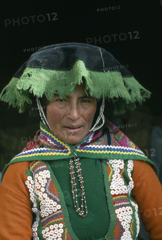 PERU, Cordillera Vilcanota, Head and shoulders portrait of woman from Tinqui.