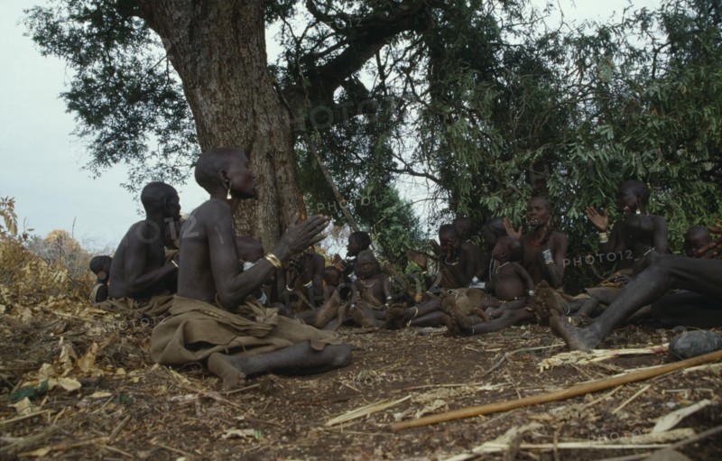 ETHIOPIA, Tribal People, Mursi tribe attending tribal prayer meeting.
