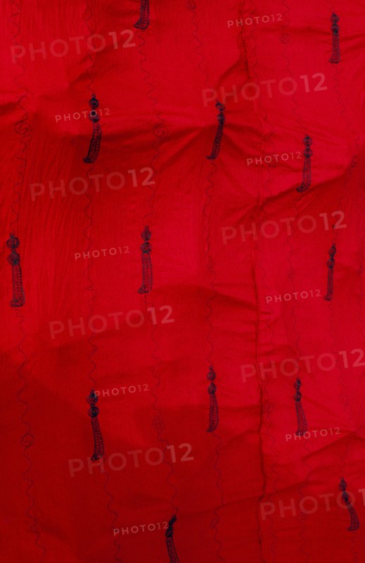 GHANA, Ashanti , Close up of traditional red Ashanti funeral cloth with pattern of swords.