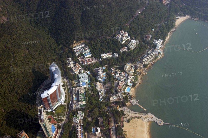 HONG KONG, General, Aerial view looking directly down on section of coastline with sandy beach and hotel pools
