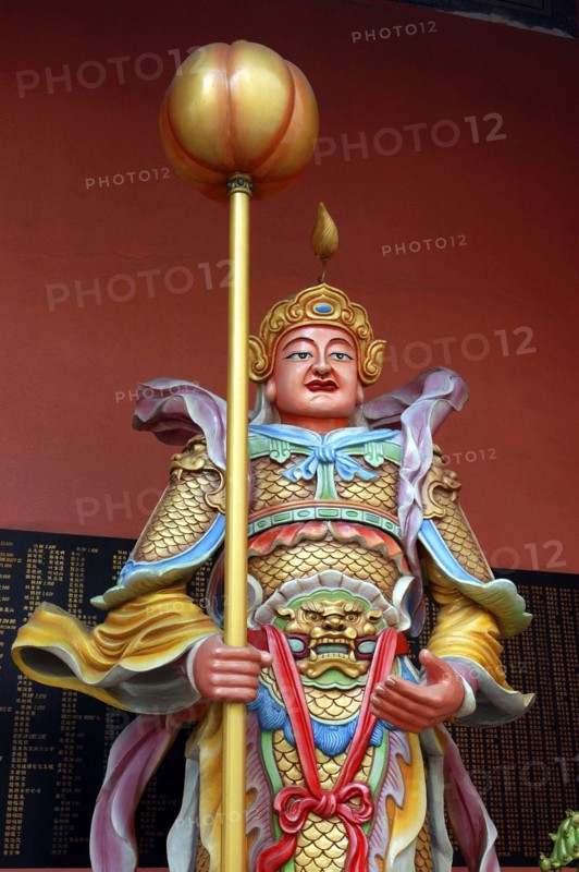 MALAYSIA, Kuala Lumpur, Chinatown, Colourful statue of a figure holding a staff