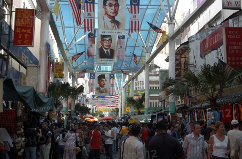 MALAYSIA, Kuala Lumpur, Chinatown, View along a covered market street lined with stalls