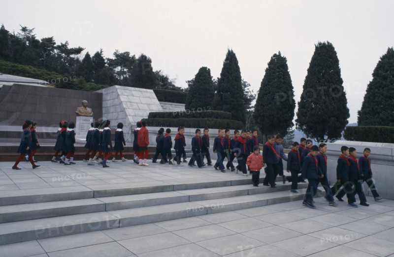 NORTH KOREA, Pyongyang, Group of children visiting the Tomb of the Martyrs outside the city.