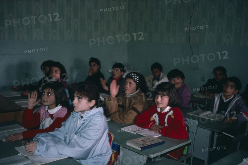ARMENIA, Gjumri, Pupils at desk in school classroom.
