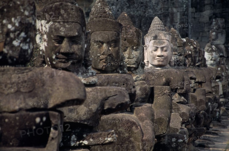CAMBODIA, Siem Reap, Angkor Thom, South Gate causeway lined with statues of various gods the paler faced one recently restored
