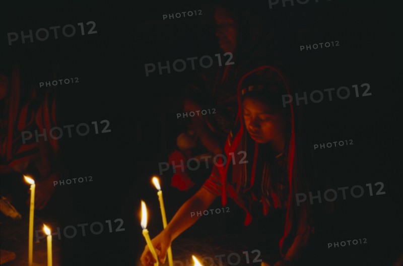 GUATEMALA, "				", Cakchiquel Maya, Woman taking part in candlelit prayers