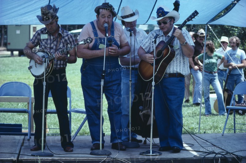 USA, West Virginia, Fort Vienna, Country and Western band playing on stage under blue tent.