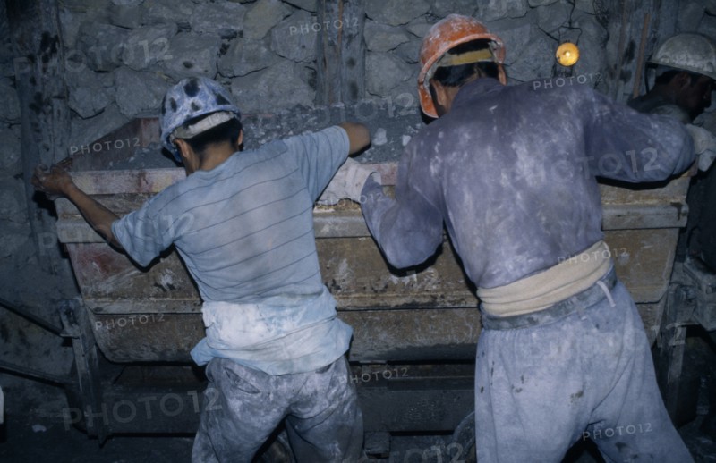 BOLIVIA, Potosi, Cerro Rico, "Rosaria mine.  Mining for tin and silver, miners working underground."