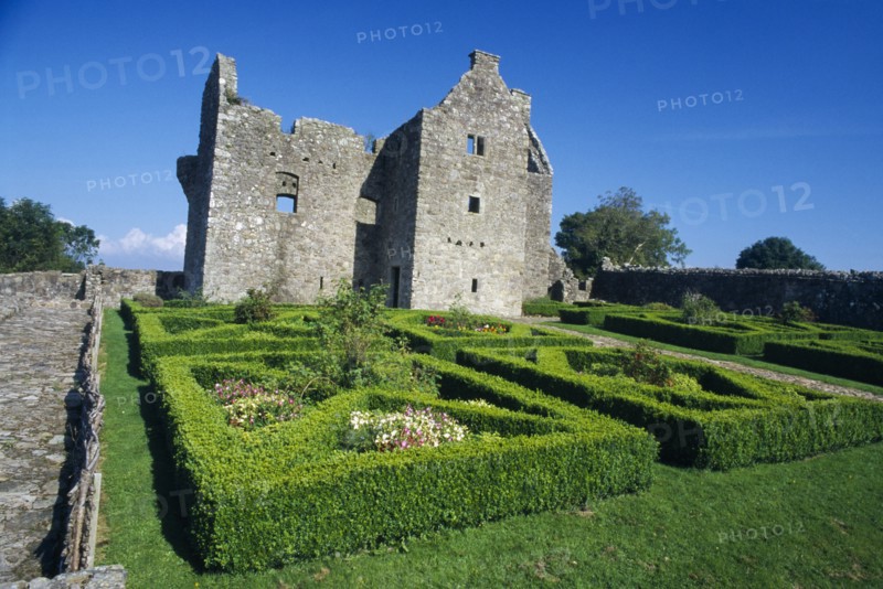 NORTHERN IRELAND, Fermanagh, Tully, Tully Castle. Ruins of a fortified plantation house dating from 1610 with recently planted early 17th century style formal garden