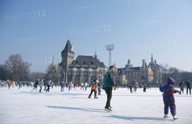 HUNGARY, Budapest, Ice skaters on outdoor rink.