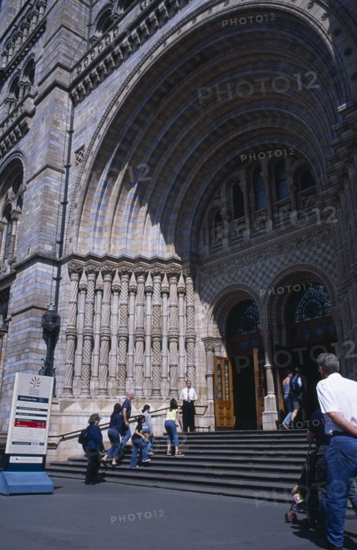 20059177 ENGLAND  London Kensington. Natural History Museum. Exterior view  with visitors walking up the steps to the main entrance.