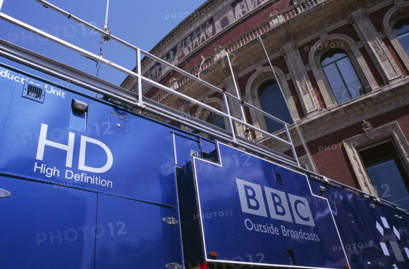 20059180 ENGLAND  London Kensington. The Royal Albert Hall. Part view of the exterior with a blue BBC Outside Broadcast truck in front.