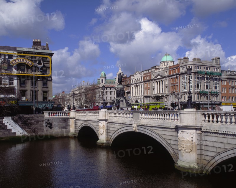 IRELAND, Dublin, O'Connell Street and Bridge with people walking across
