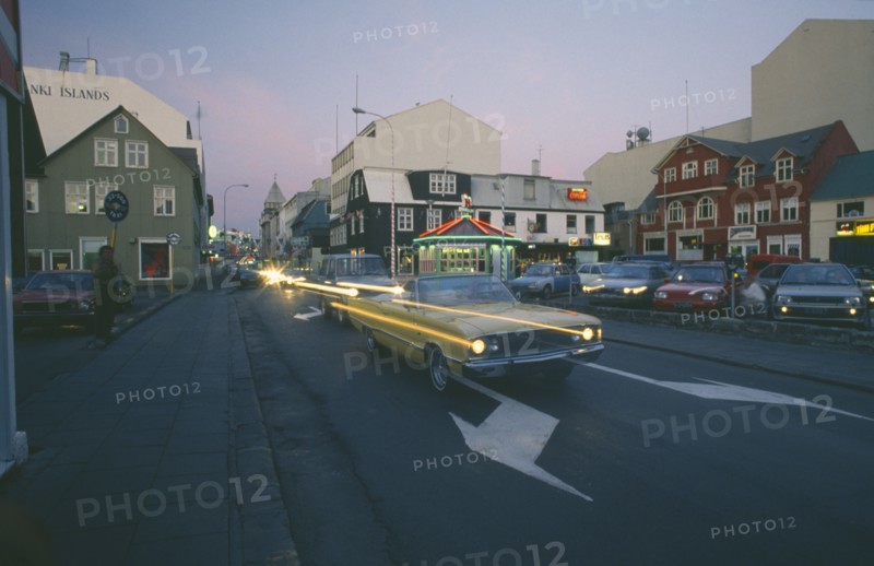 ICELAND, Reykjavik, City centre traffic on Summer evening.