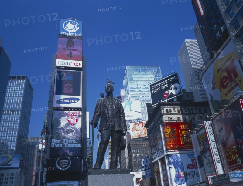 USA, New York, Manhattan, Times Square architecture and billboards with statue in the foreground