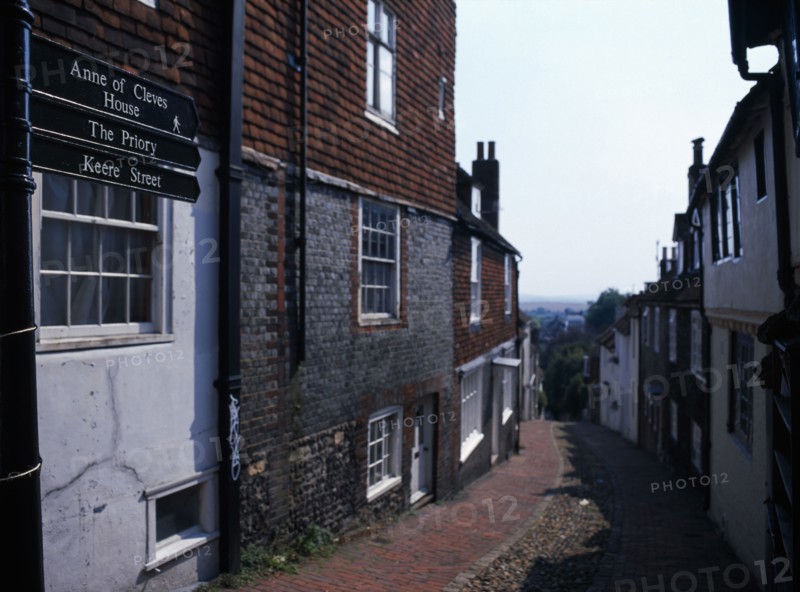 20059219 ENGLAND East Sussex Lewes View down cobbled old street with cottage housing and a street sign showing directions towards the Ann of Cleves House and The Priory.