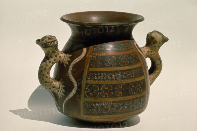 PERU, Archaeology, Inca ceremonial ceramic vessel with handles carved in the form of jaguars.