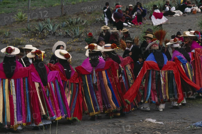 ECUADOR, Tungurahua, Salasaca, Corpus Christi dancers in colourful costume during celebrations held in June in honour of the Eucharist.