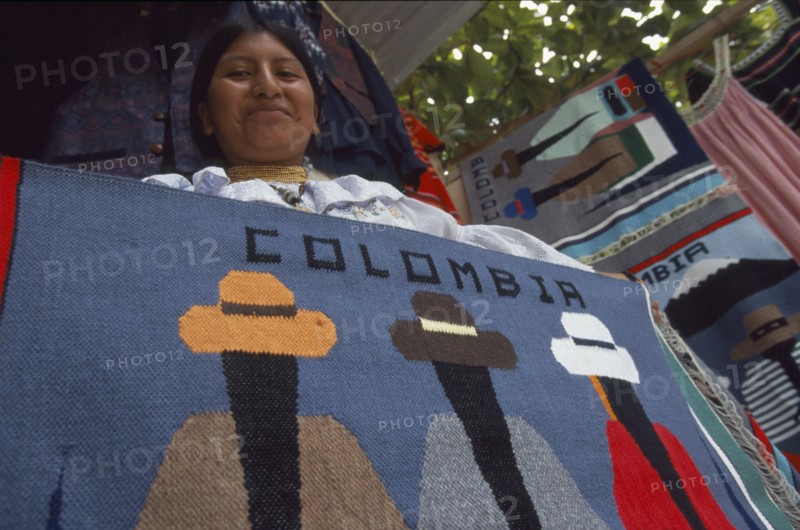 COLOMBIA, Amazonas, Leticia, Ecuadorean Otavalan Indian woman selling textile souvenirs.