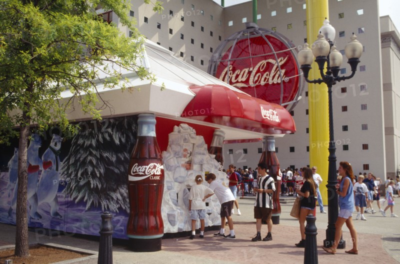 USA, Georgia, Atlanta, World of Coca Cola pavilion exterior with crowds of visitors.