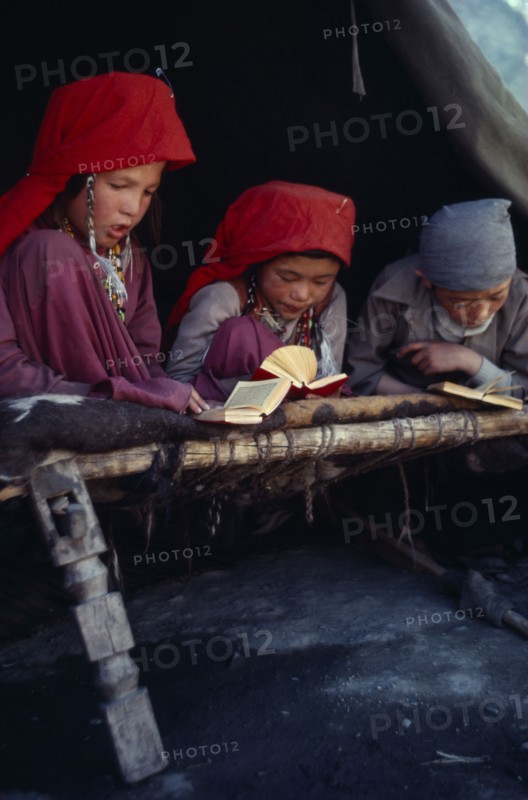 AFGHANISTAN, Kirghiz, Kirghiz boys and girls reading the Koran.