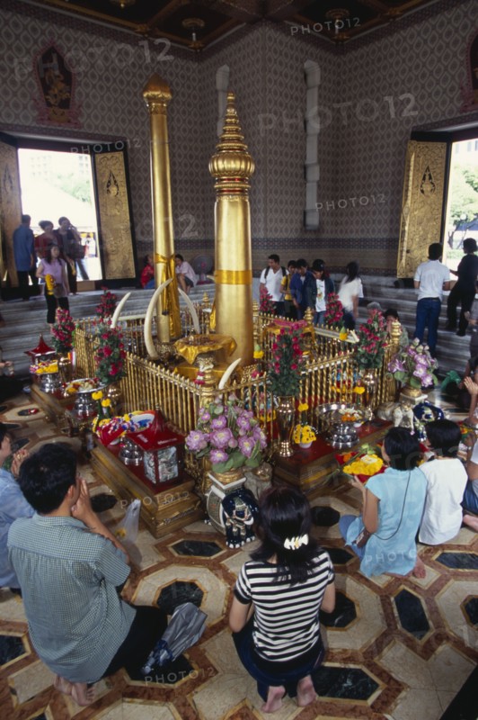 THAILAND, South, Bangkok, Wat Meuang the City pillar the most important animist shrine in Bangkok with devotees making offerings