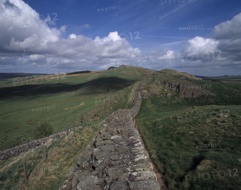 ENGLAND, Northumberland, Hadrians Wall, View along stretch of ruined wall at Cawfields