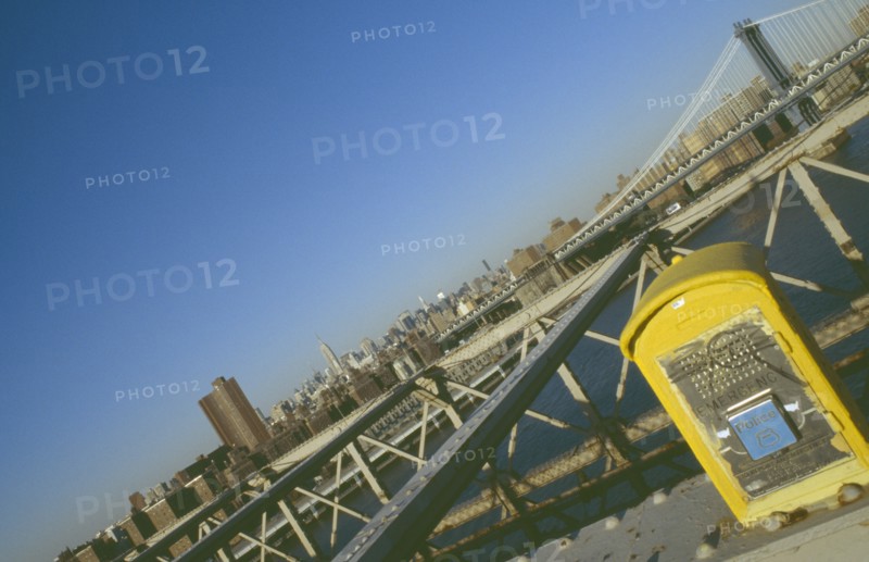 USA, New York, Manhattan, Manhattan and the Empire State building viewed from the walkway on the Brooklyn Bridge