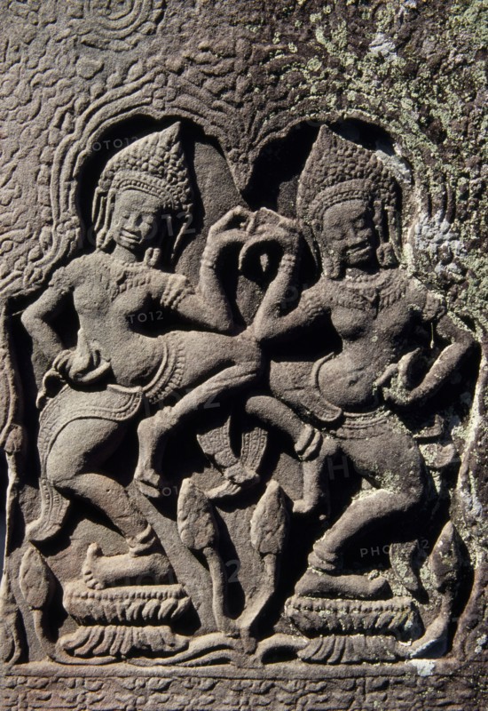 CAMBODIA, Siem Reap Province, Angkor Thom, The Bayon.  Detail of carving of two dancing Asparas