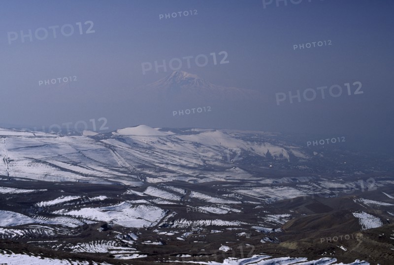 ARMENIA, Mount Ararat, Aerial view over Mount Ararat in Turkey from Vokhchaberd with polluted air from Yerevan on the right.