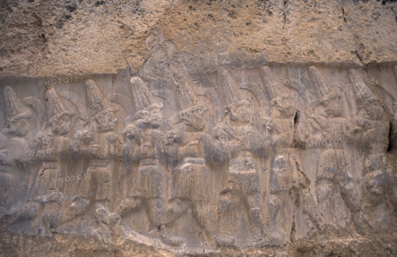 TURKEY, Central Anatolia, Corum, Hattusas.  Ancient site of Hittite capital.  Stone relief carving in the Great Temple dedicated to the storm god Teshub and the sun goddess Hebut.