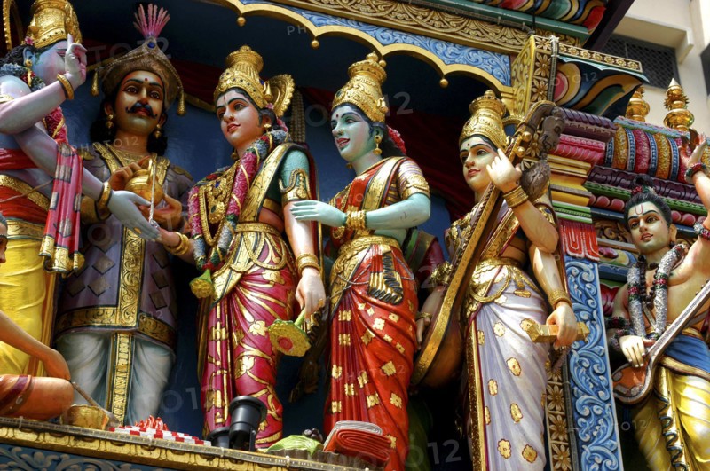 SINGAPORE, , Colourful statues of women in saris at an Indian Hindu Temple