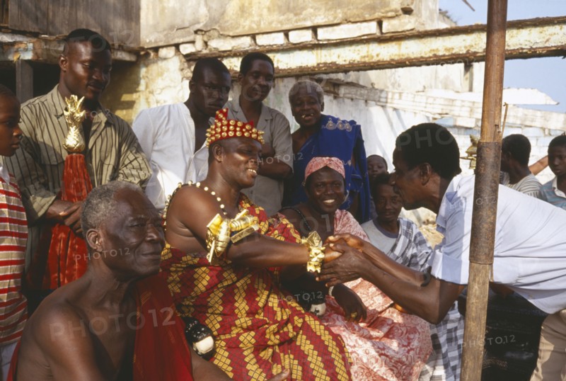 GHANA, Accra, Ashanti chief receiving obeisance in village outside Accra.