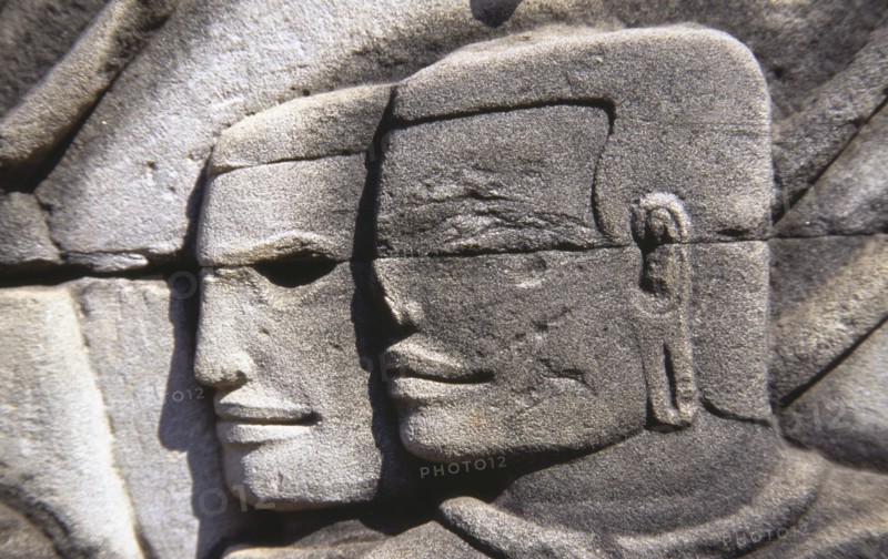 CAMBODIA, Siem Reap, Angkor Thom, Bayon Temple south gallery bas relief of two male faces