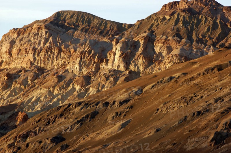 USA, California, Death Valley, View of red layered sculpted rock hills