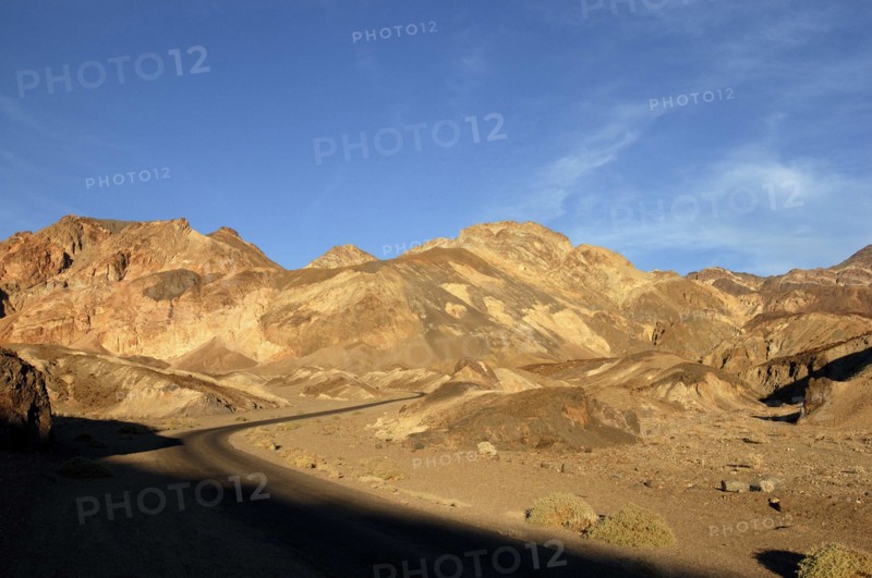 USA, California, Death Valley, View over layered sculpted rock hills in the golden afternoon sun