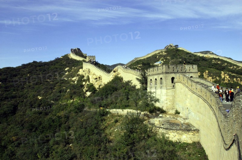 CHINA, Great Wall, View alongside a section of the wall which runs through the hilly green landscape
