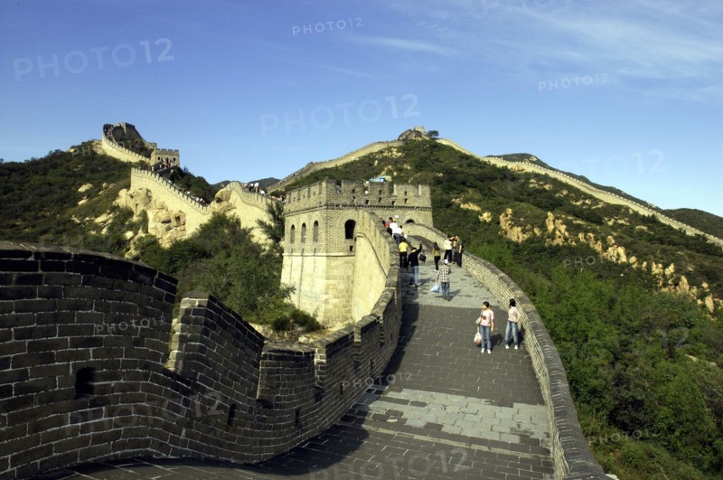 CHINA, Great Wall, View along a section of the wall which leads through the green hilly landscape