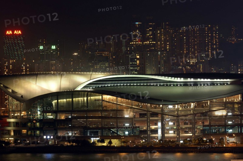 HONG KONG, Kowloon, View of the New Convention Centre illuminated at night
