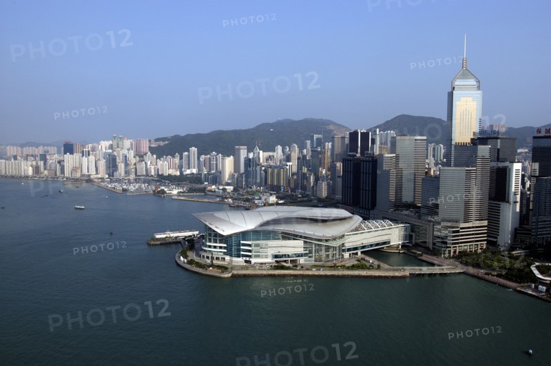 HONG KONG, Kowloon, Aerial view over the New Convention Centre on the waterfront and cityscape behind
