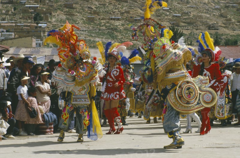 BOLIVIA, Oruro, La Diablada Carnival procession and spectators.