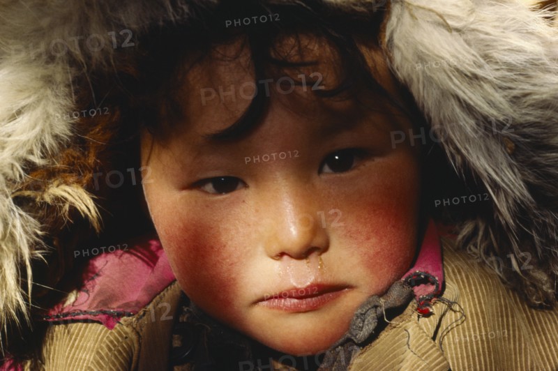 CHINA, Xinjiang, Altai, Portrait of Kazakh child.