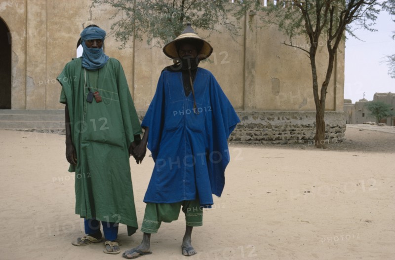 MALI, People, Two Touareg men in traditional dress holding hands.
