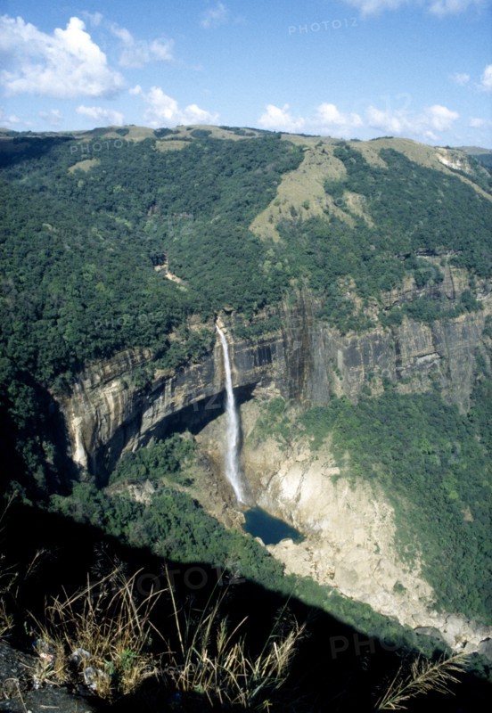 INDIA, Meghalaya, Cherrapunji, Waterfall cascading from plateau into plunge pool below
